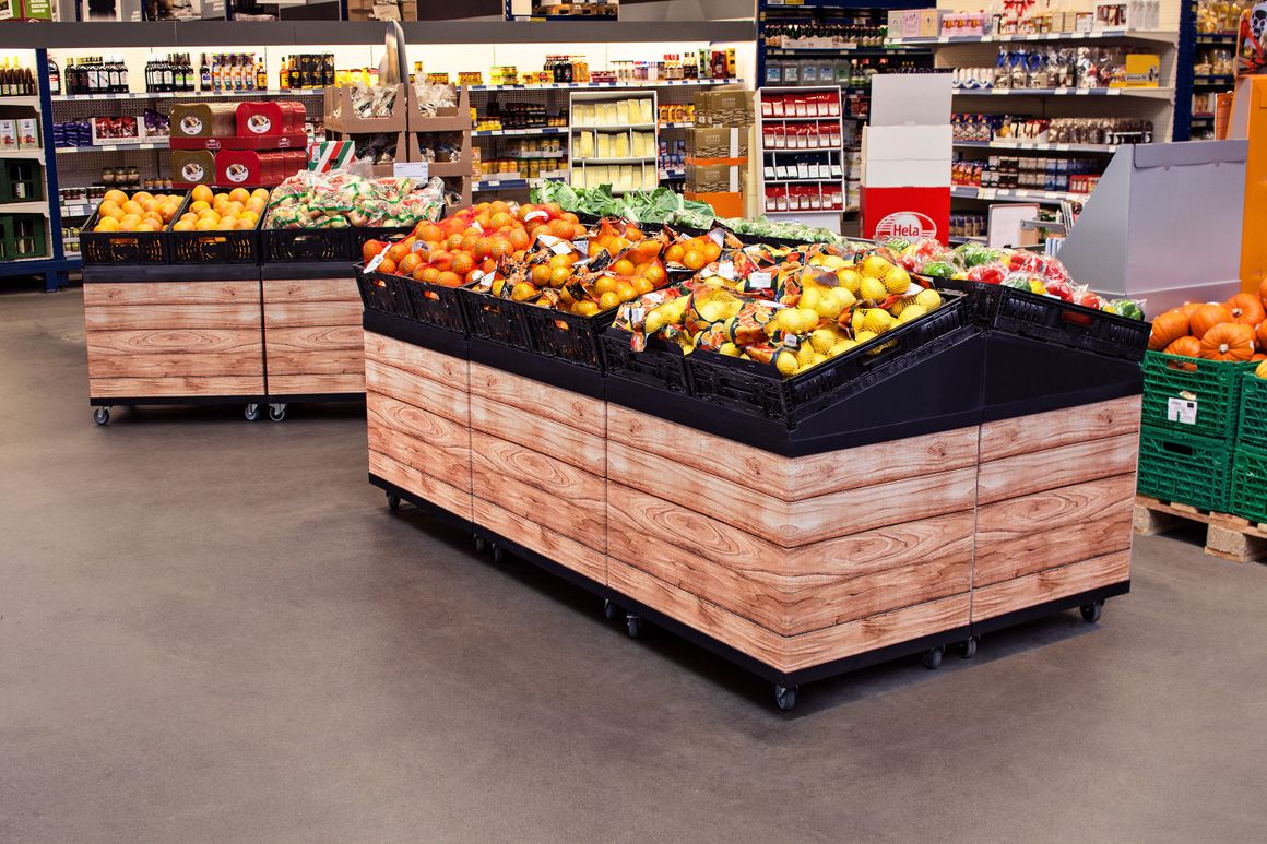 Fruit and Vegetable Island Displays in a Supermarket