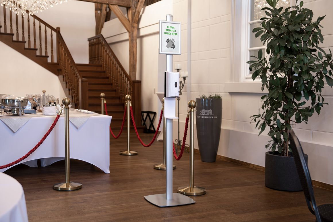 Disinfection dispenser free-standing with sensor at the buffet