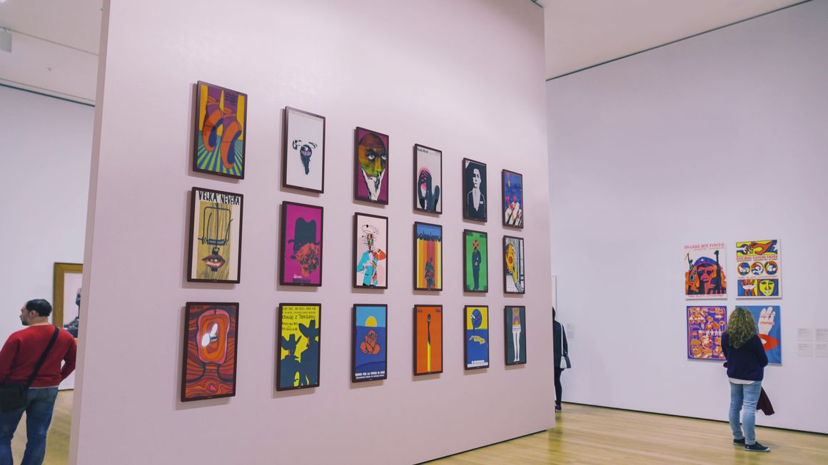 E-Paper poster displays hanging on a wall in a gallery